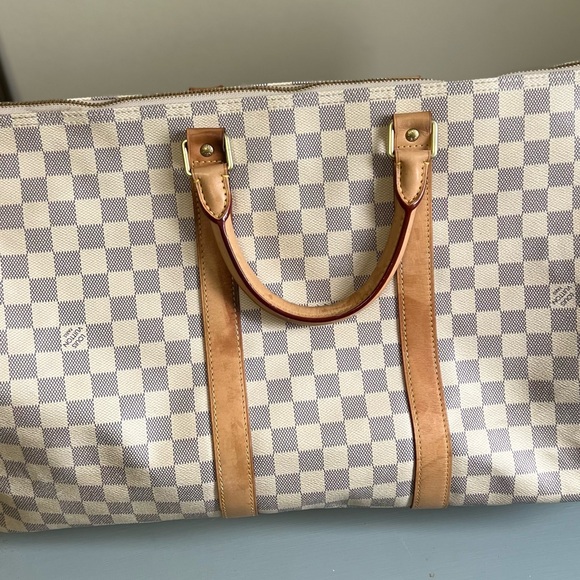 Louis Vuitton duffle bag, two of the straps are damaged as shown in pictures. - Picture 3 of 15